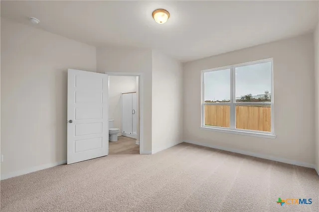 an empty room with a empty space and a window