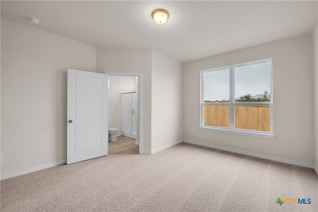 417 University Avenue Troy, TX 76579 - Photo 11 of 30 an empty room with a empty space and a window