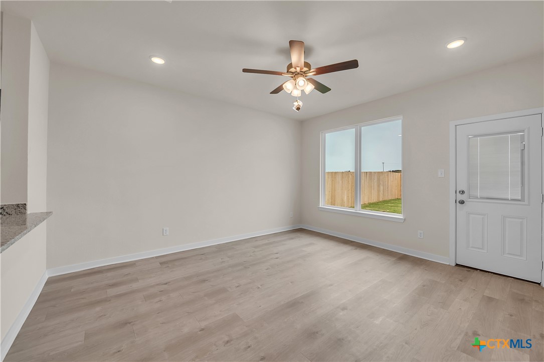 417 University Avenue Troy, TX 76579 - Photo 16 of 30 an empty room with windows and fan
