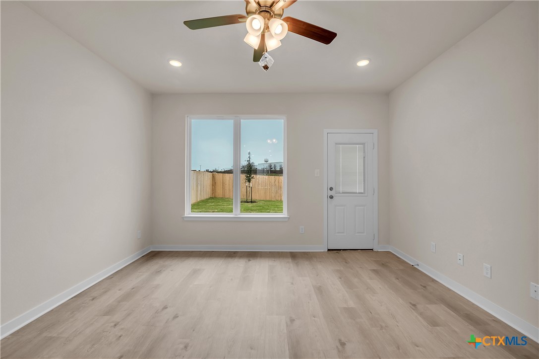417 University Avenue Troy, TX 76579 - Photo 17 of 30 an empty room with window and ceiling fan