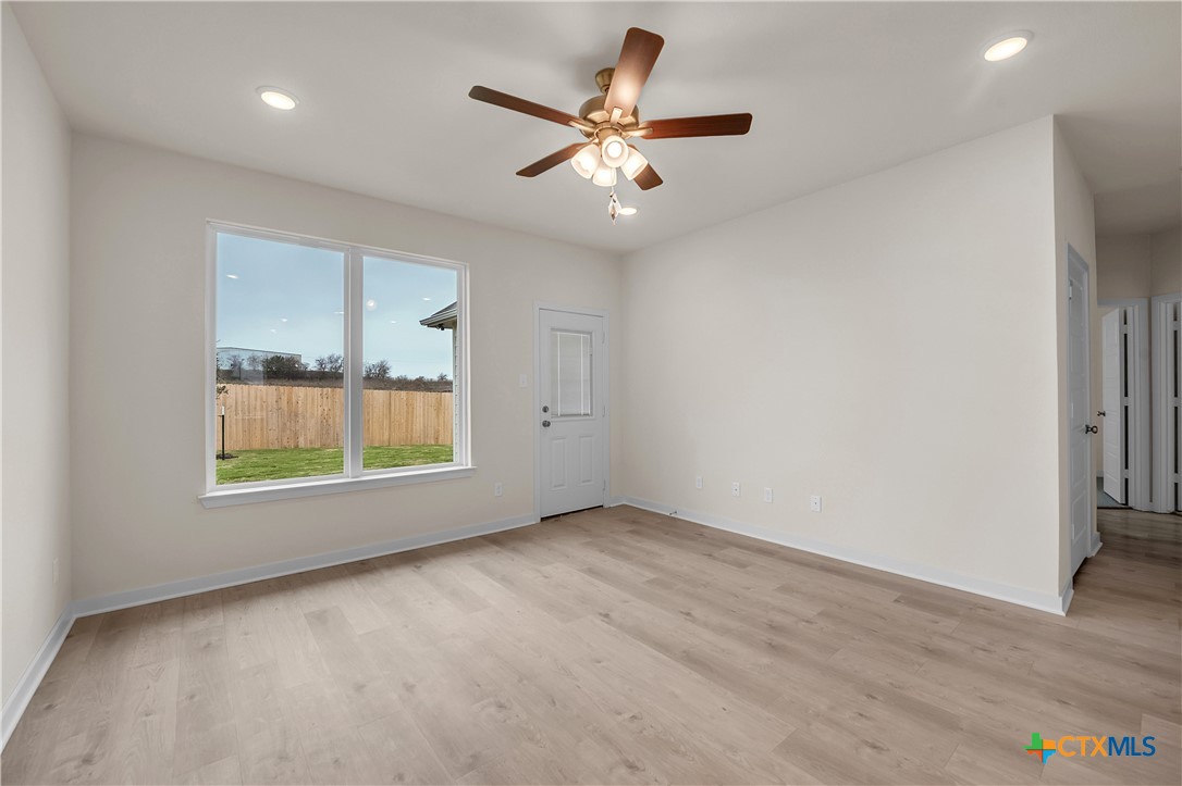 417 University Avenue Troy, TX 76579 - Photo 18 of 30 an empty room with a window and a ceiling fan