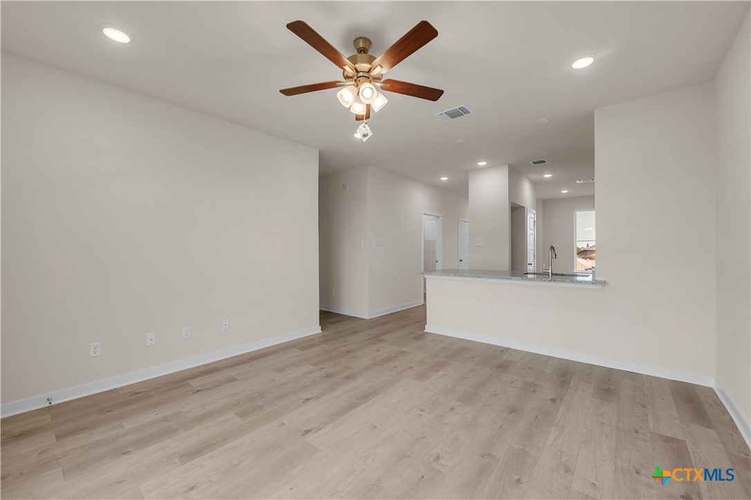 417 University Avenue Troy, TX 76579 - Photo 19 of 30 an empty room with fan and a ceiling fan