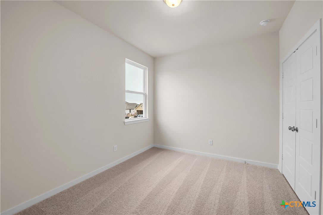 417 University Avenue Troy, TX 76579 - Photo 8 of 30 a view of an empty room and a window