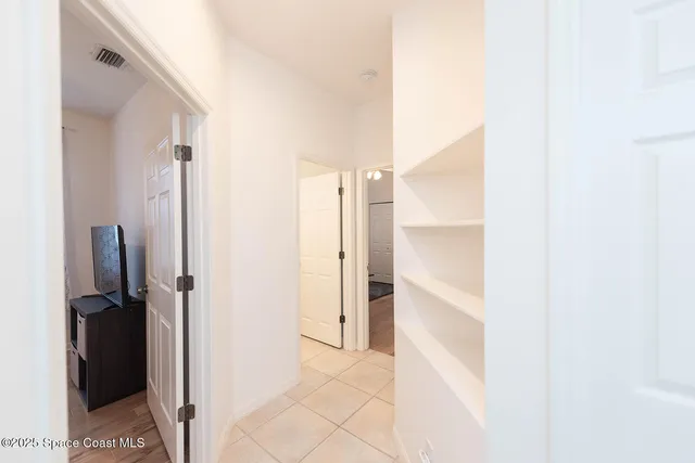 a view of a room with wooden walls