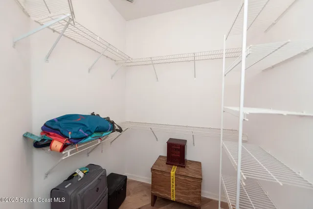 a white toilet sitting next to a shower