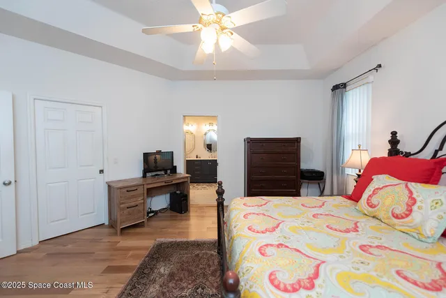 a bathroom with a glass shower door and a window