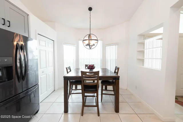a kitchen with granite countertop a sink appliances cabinets and counter space