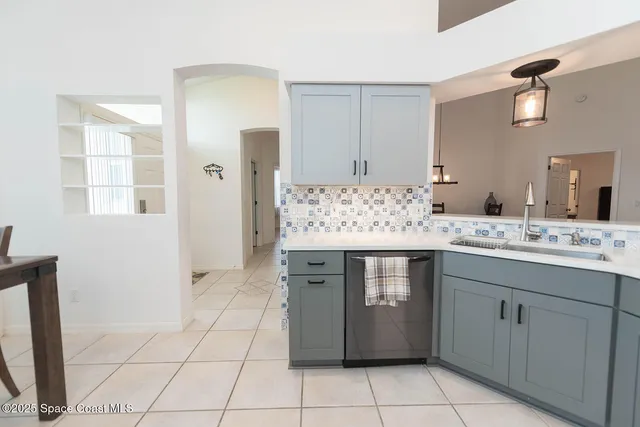 a kitchen with a table and chairs