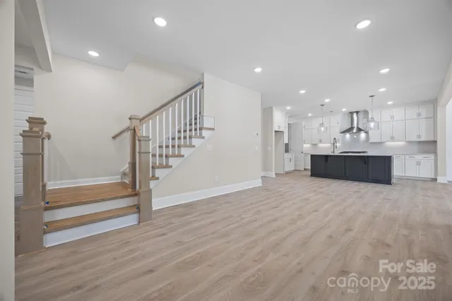 a view of a kitchen with a sink and a stove top oven
