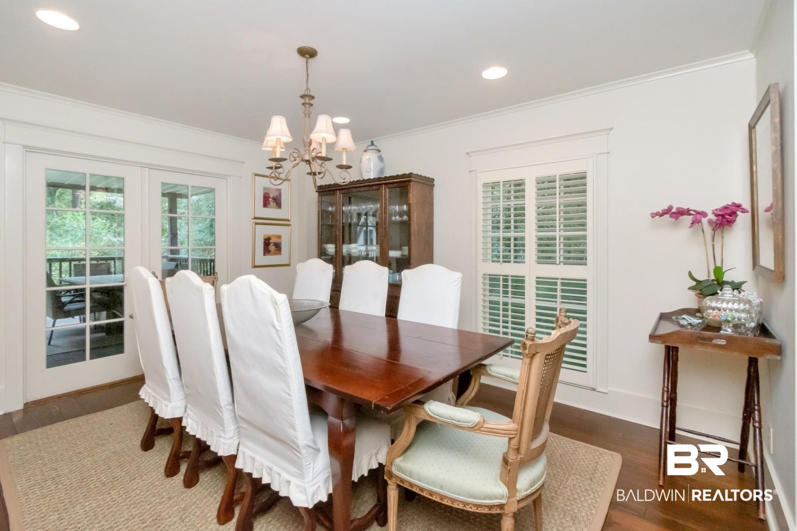4810 Mums Court Mobile, AL 36608 - Photo 11 of 50 Dining area featuring crown molding, dark wood-type flooring, plenty of natural light, recessed lighting, and a chandelier