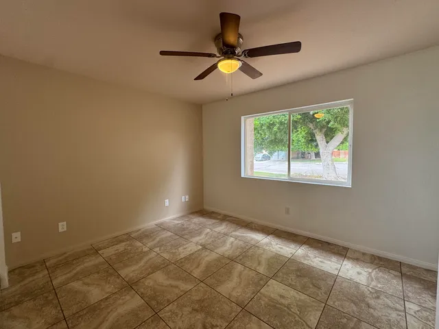 a view of an empty room and window