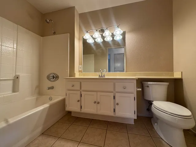 a bathroom with a sink a toilet and a bathtub
