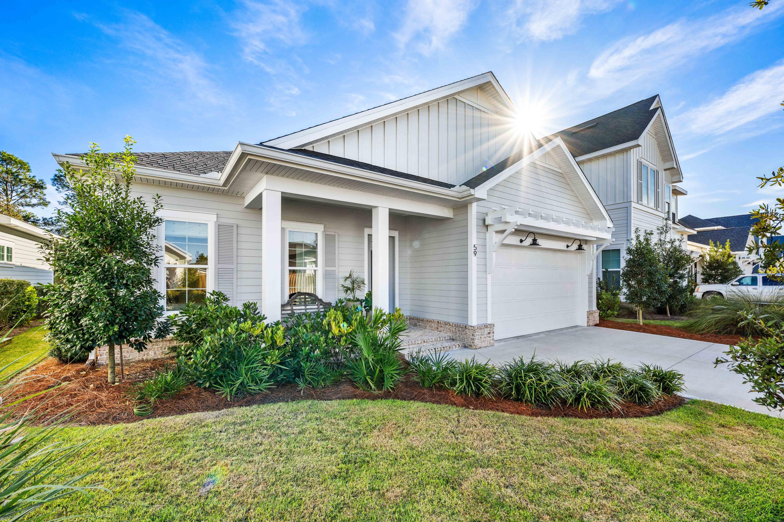 59 Suwannee Dr Inlet Beach Inlet Beach, FL 32461 - Photo 2 of 47 a front view of a house with garden