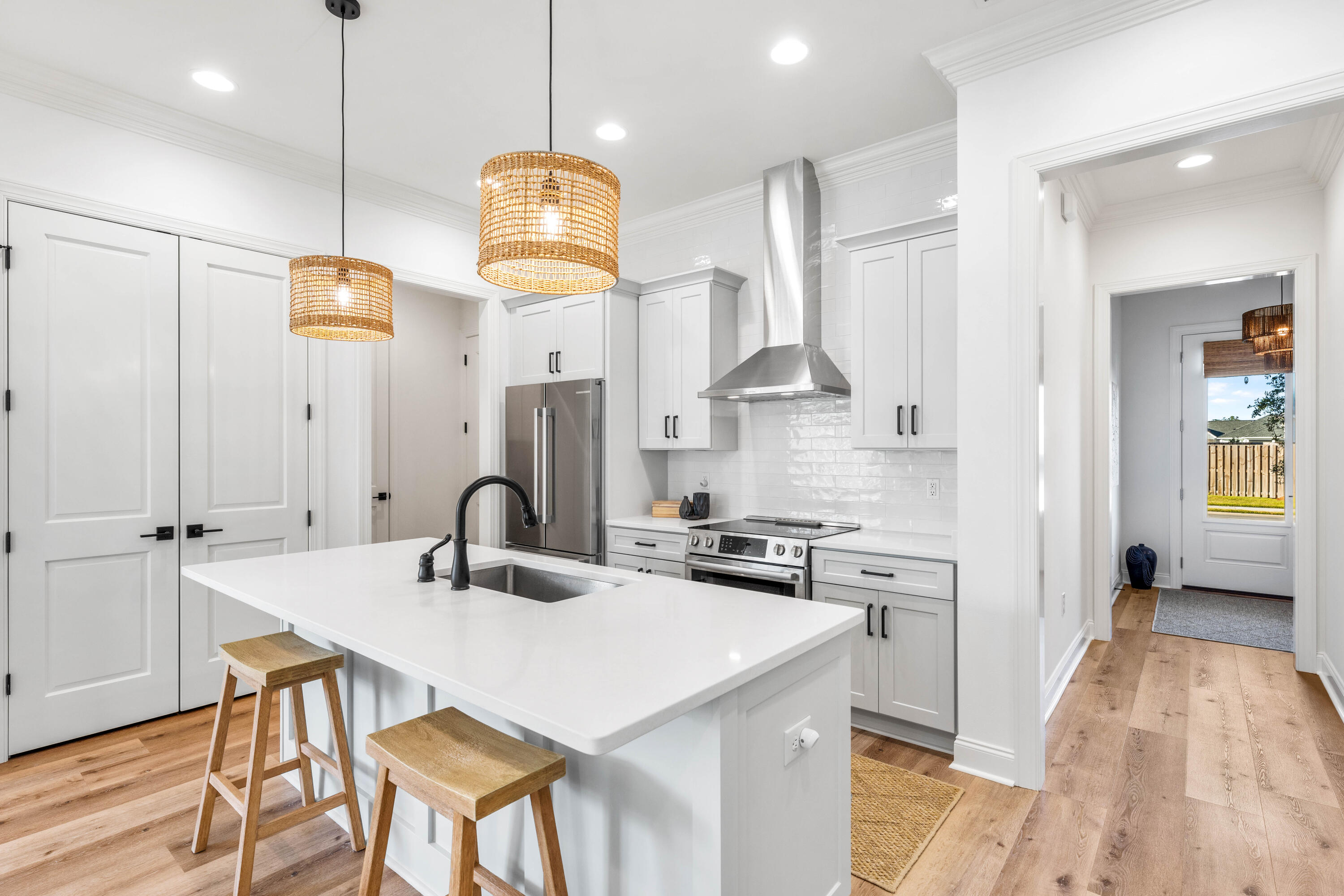 59 Suwannee Dr Inlet Beach Inlet Beach, FL 32461 - Photo 24 of 47 a kitchen with stainless steel appliances granite countertop a sink a stove a refrigerator and island with wooden floor
