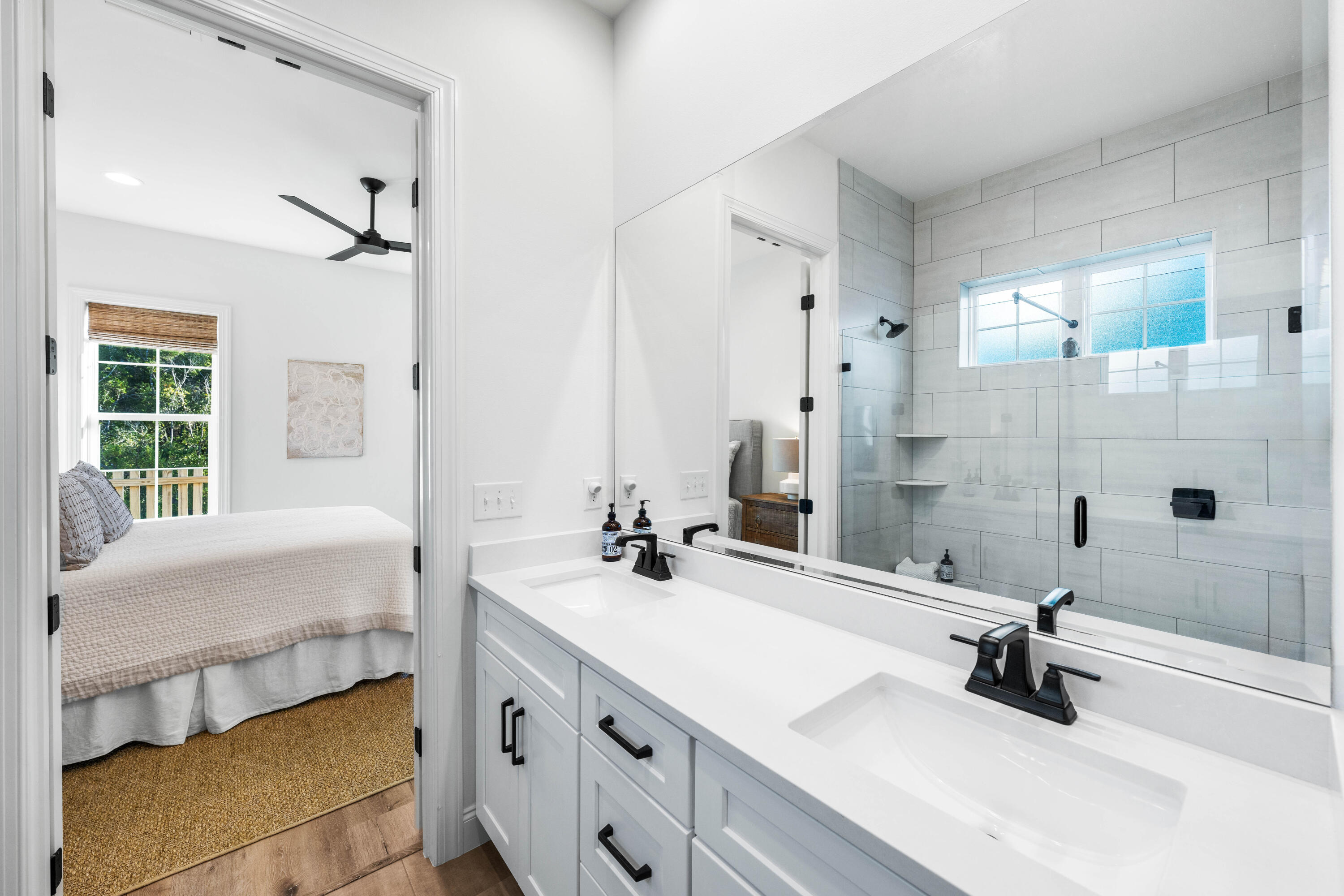 59 Suwannee Dr Inlet Beach Inlet Beach, FL 32461 - Photo 30 of 47 a bathroom with a double vanity sink a mirror and a bathtub