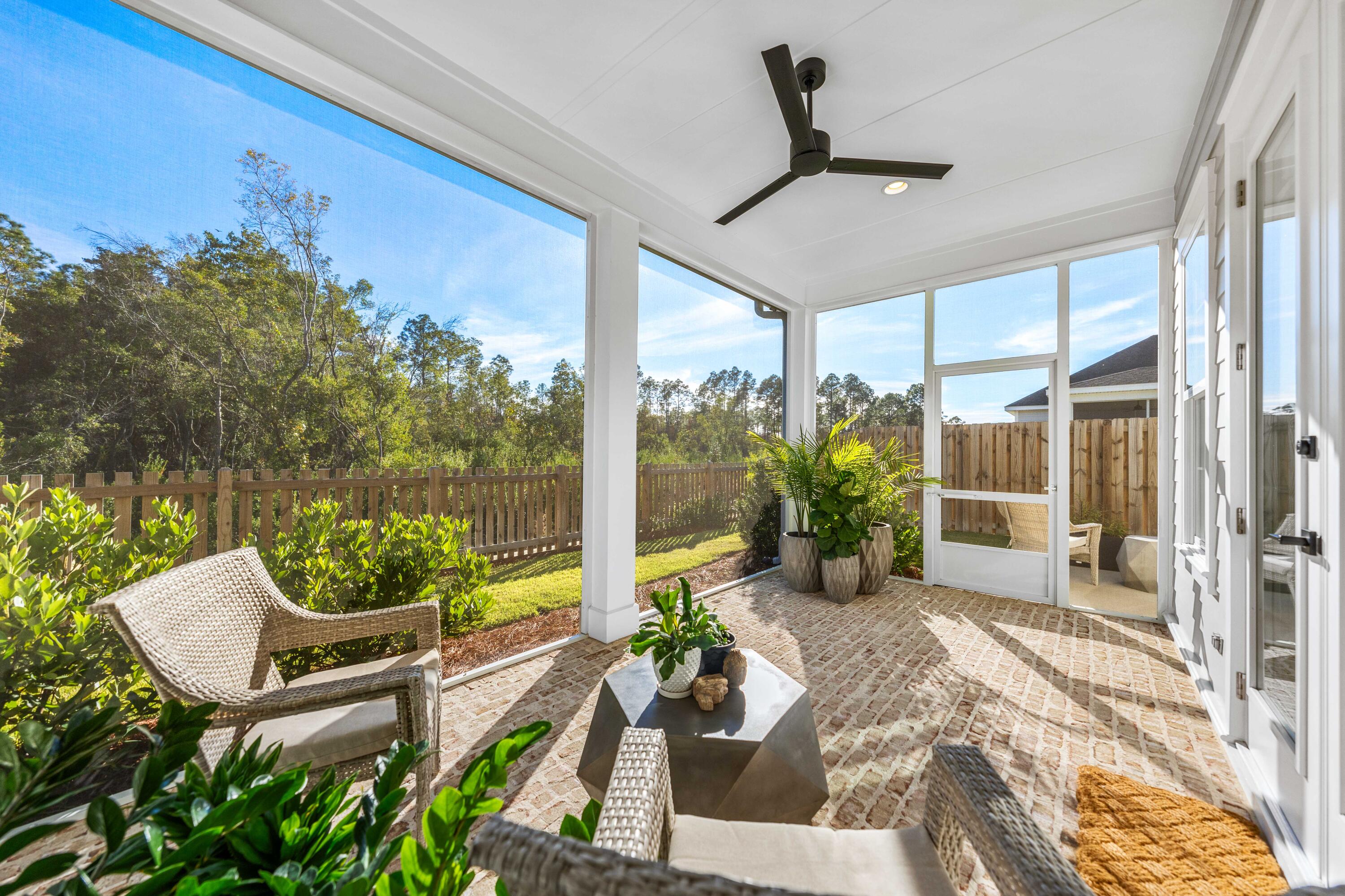 59 Suwannee Dr Inlet Beach Inlet Beach, FL 32461 - Photo 7 of 47 a view of a chairs and table in patio with potted plants