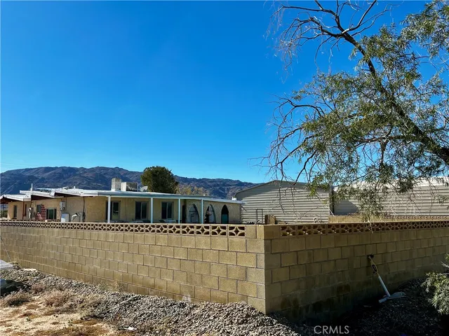 a view of a hallway with dining area