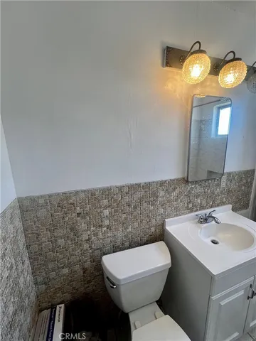 a view of a backyard with sitting area