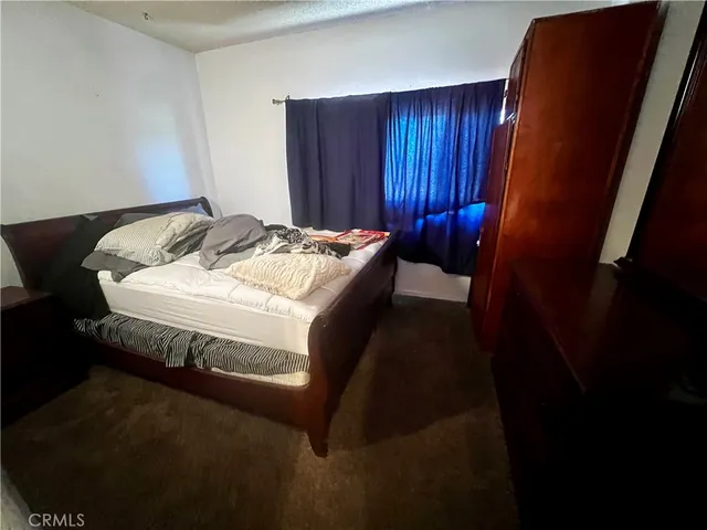 a view of a patio with table and chairs