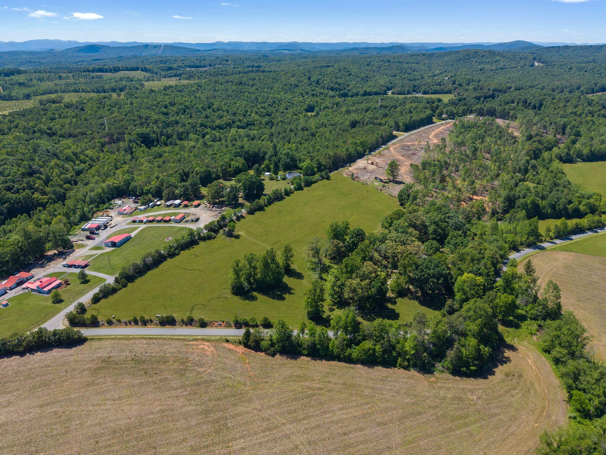 1115 Robin Ridge Road Henry, VA 24102 - Photo 52 of 54 an aerial view of a houses with a yard and lake view