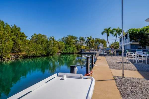 an aerial view of a house with a yard basket ball court and outdoor seating