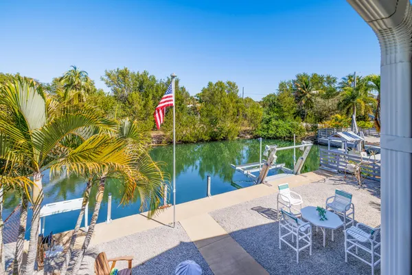 a small pool with table and chairs