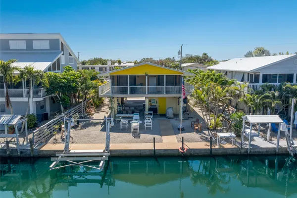 a view of houses with outdoor space and swimming pool