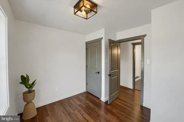 a bathroom with a granite countertop shower and a toilet