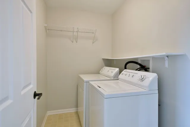a view of a balcony with wooden floor and fence