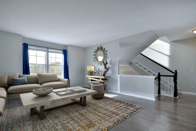 a living room with furniture and a rug