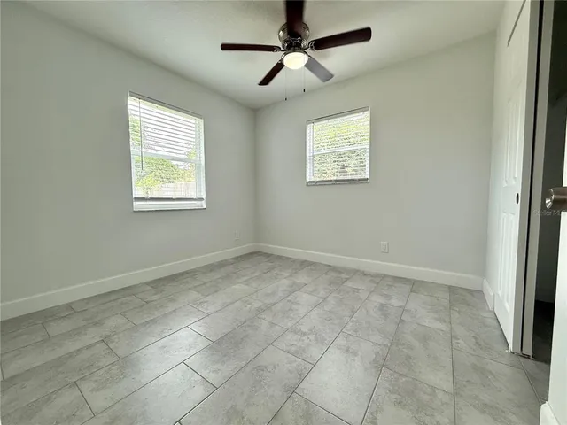 a view of an empty room with a window