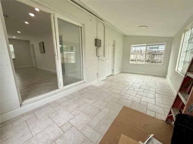 a view of an empty room and window