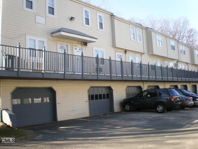 12 Scuppo Road, Unit J58 Danbury, CT 06811 - Photo 1 of 1 a view of a car parked in front of a building