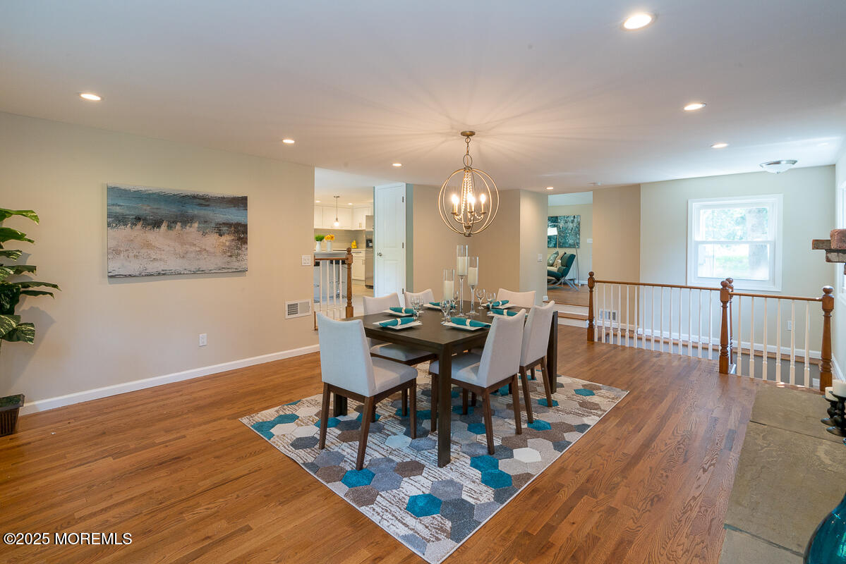 21 Wickatunk Road Manalapan, NJ 07726 - Photo 9 of 48 a view of a dining room with furniture and wooden floor