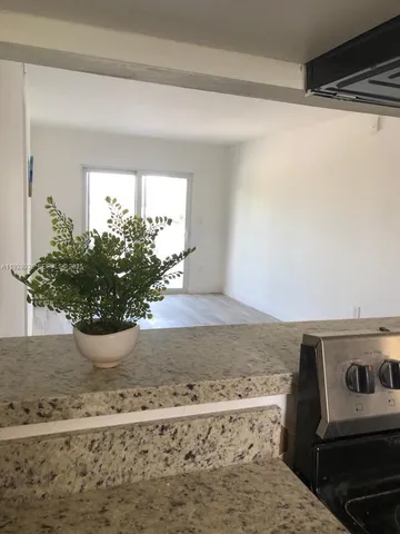 a kitchen with a stove and a microwave
