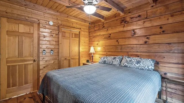 a bedroom with a bed and a closet