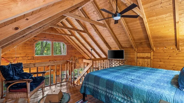 a bedroom with a bed and a chair