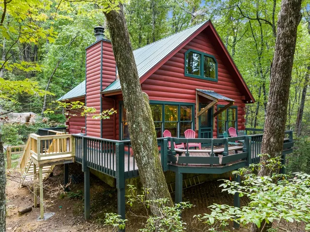 a view of an outdoor sitting area with brick walls