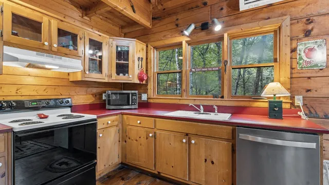 a kitchen with a sink and a stove