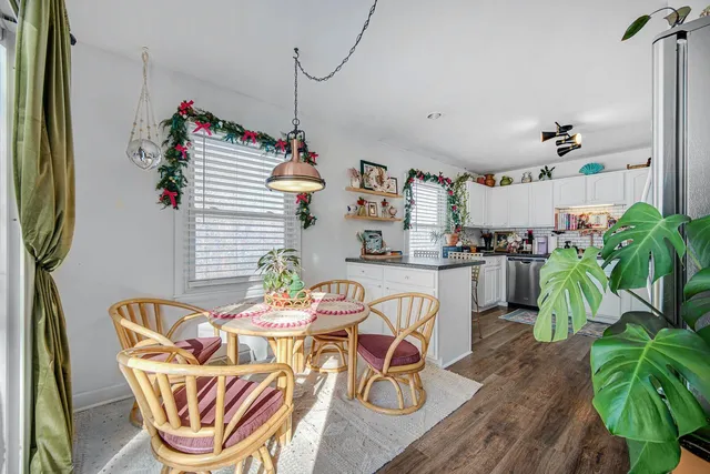 a view of a dining room with furniture window and flowerpot