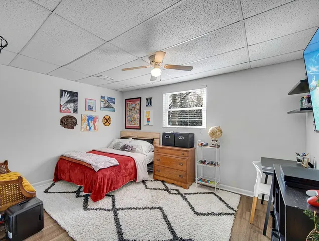 a bedroom with furniture and a window