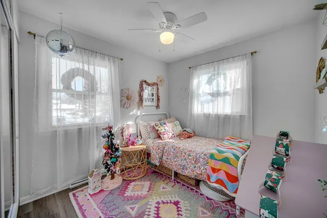 a bedroom that has a bed and a window