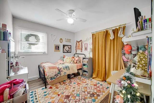 a bedroom with bed and a window