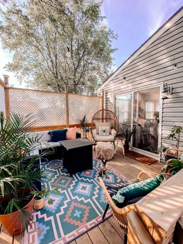a backyard of a house with yard and outdoor seating