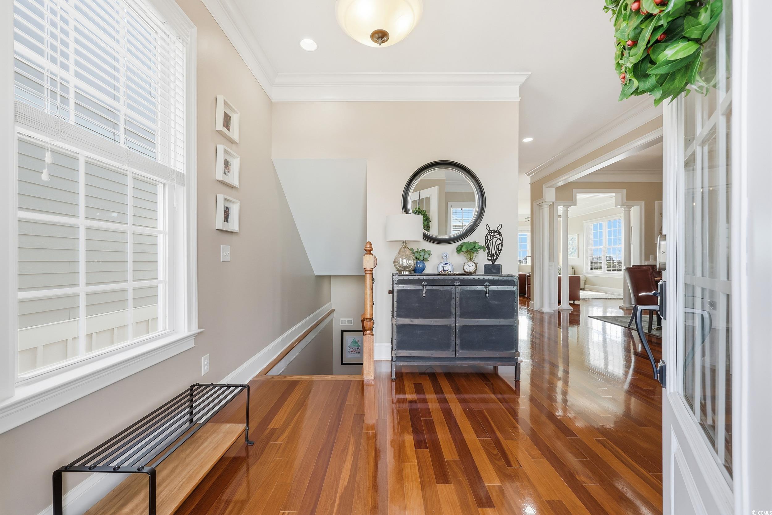 349 St.Julian Lane Myrtle Beach, SC 29579 - Photo 4 of 40 Foyer featuring dark wood-style flooring, crown molding, decorative columns, and recessed lighting