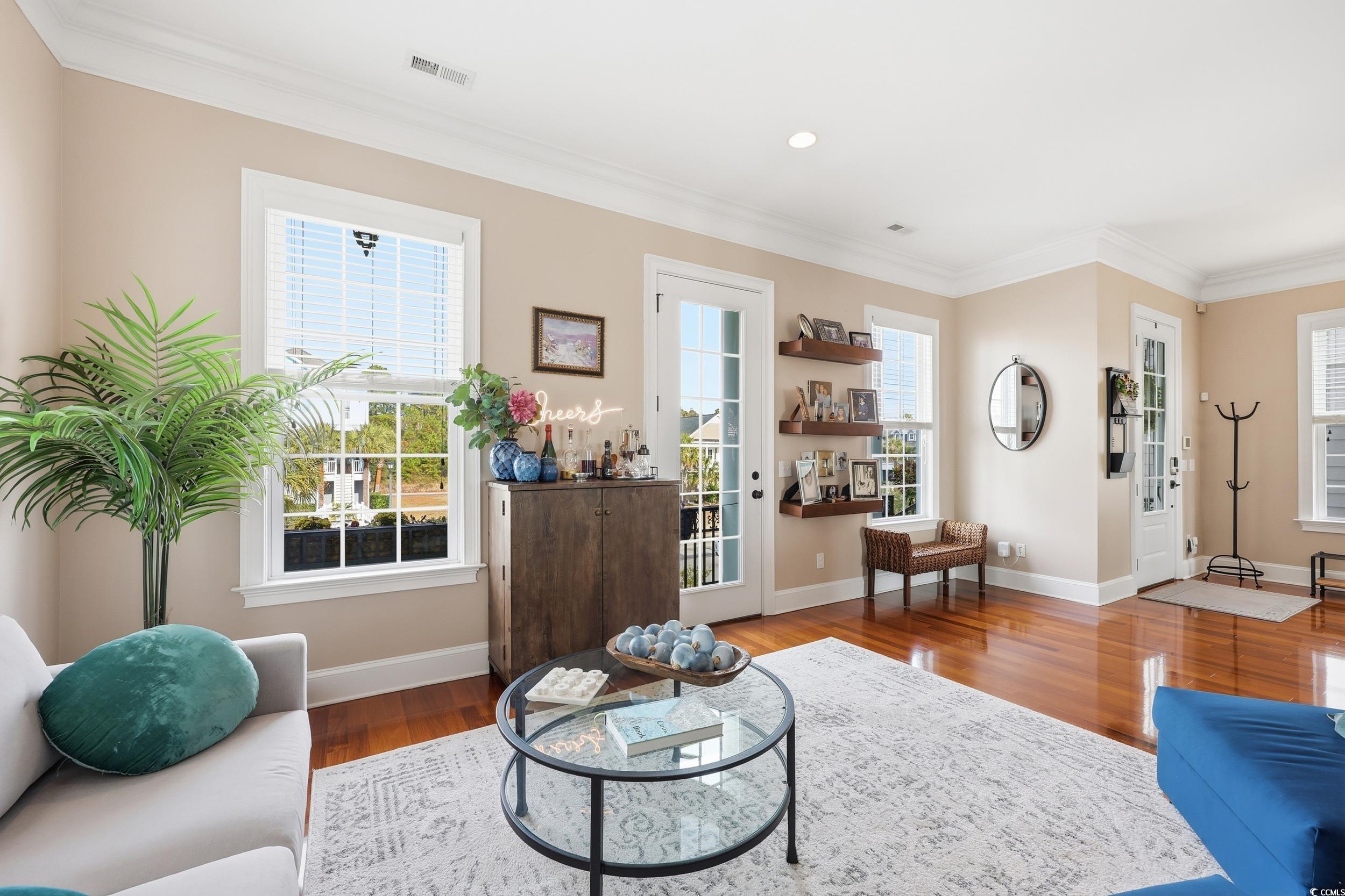 349 St.Julian Lane Myrtle Beach, SC 29579 - Photo 6 of 40 Living room with crown molding and wood finished floors