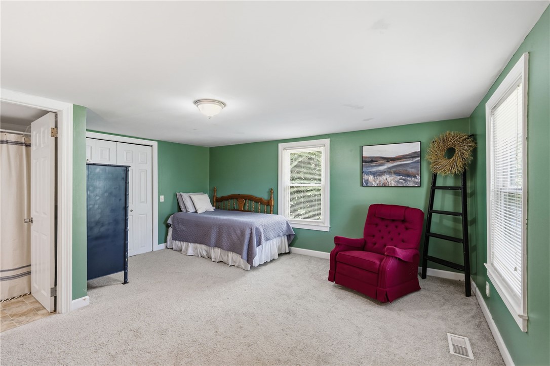 108 Tarrant Street Central, SC 29630 - Photo 27 of 42 Well-lit sleeping quarters with a dedicated dressing area and plush carpeting.