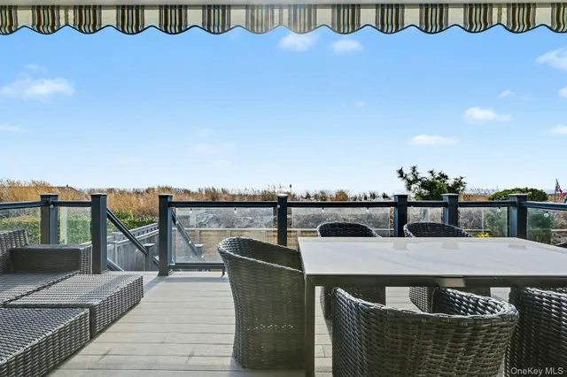 a terrace of a house with outdoor seating
