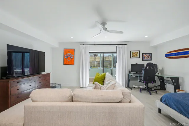 a living room with furniture and flat screen tv
