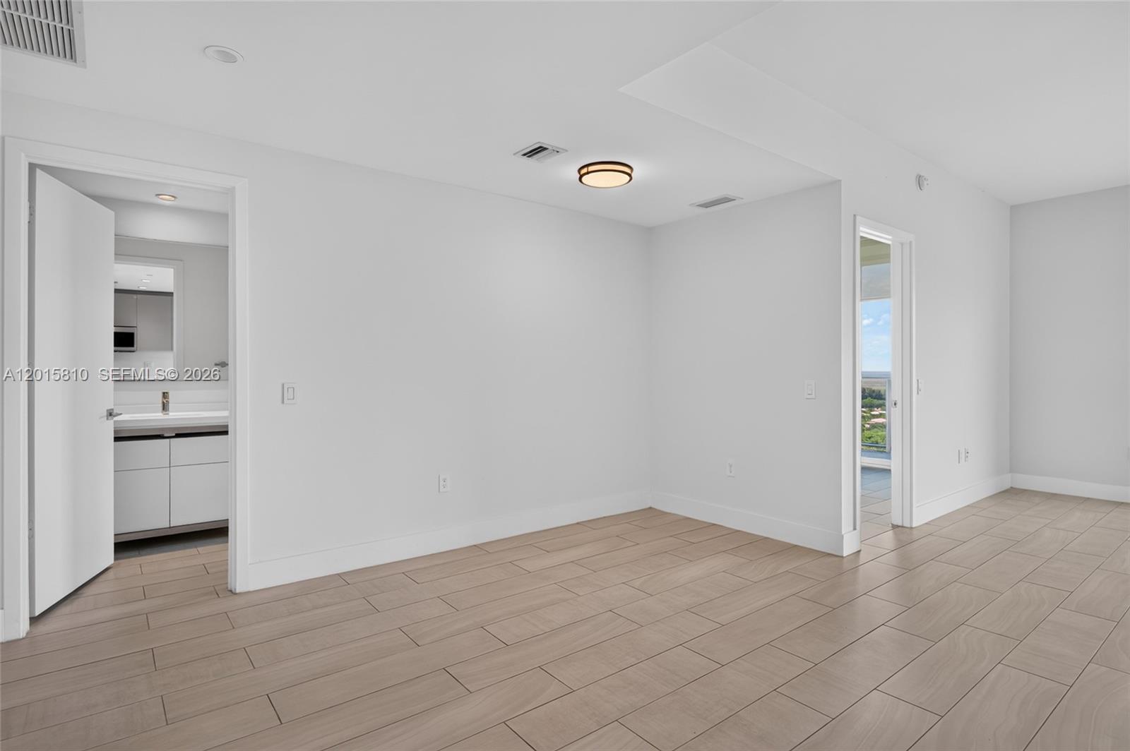 2000 Metropica Way, Unit 1902 Sunrise, FL 33323 - Photo 30 of 40 an empty room with a bathroom and a sink